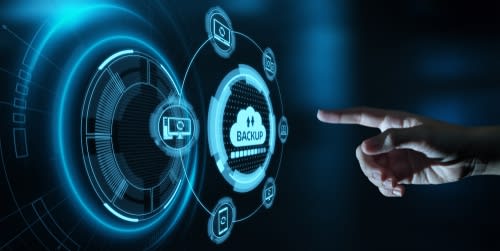 a hand pressing a digital backup icon