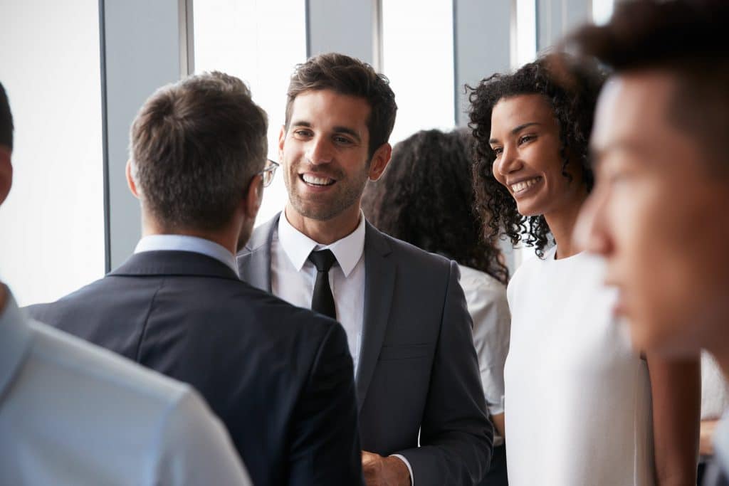 3 people meeting at a networking event