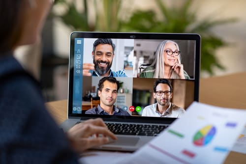 a laptop showing a web conference