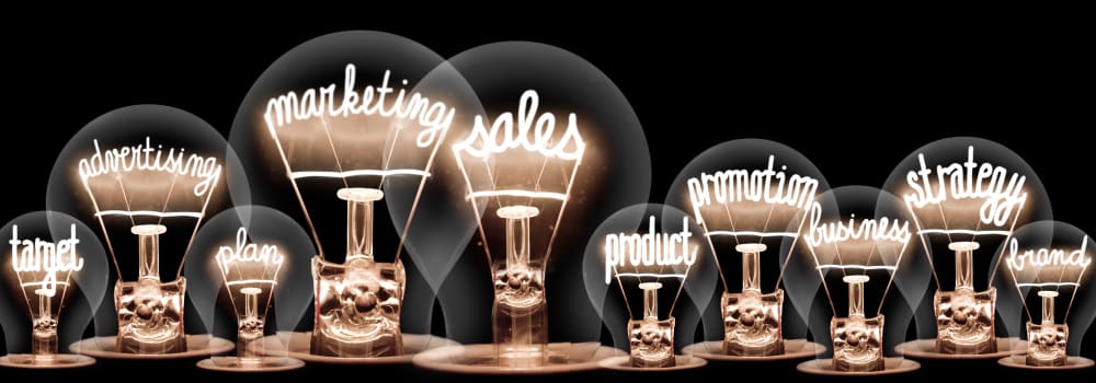 edison light bulbs with the words 'target', 'marketing', 'sales', 'product', 'promotion' and 'strategy' in the filaments