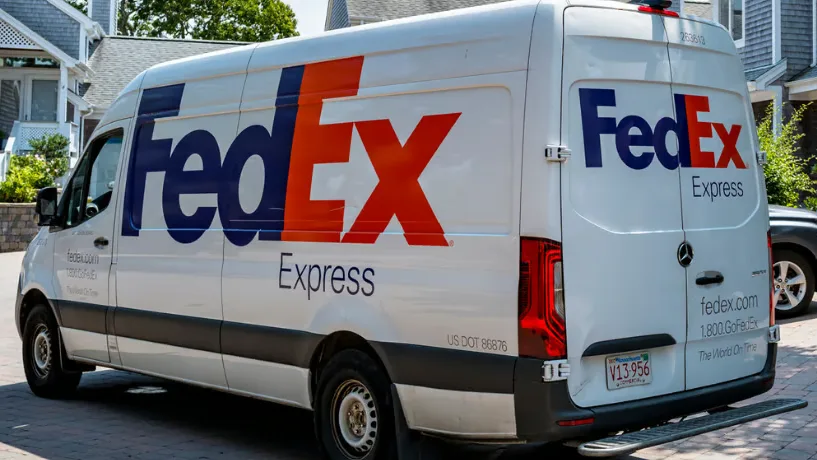 Parked FedEx van from the side with FedEx Express logo