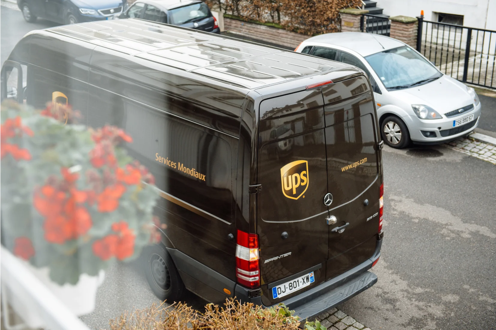 UPS Courier back of van on street