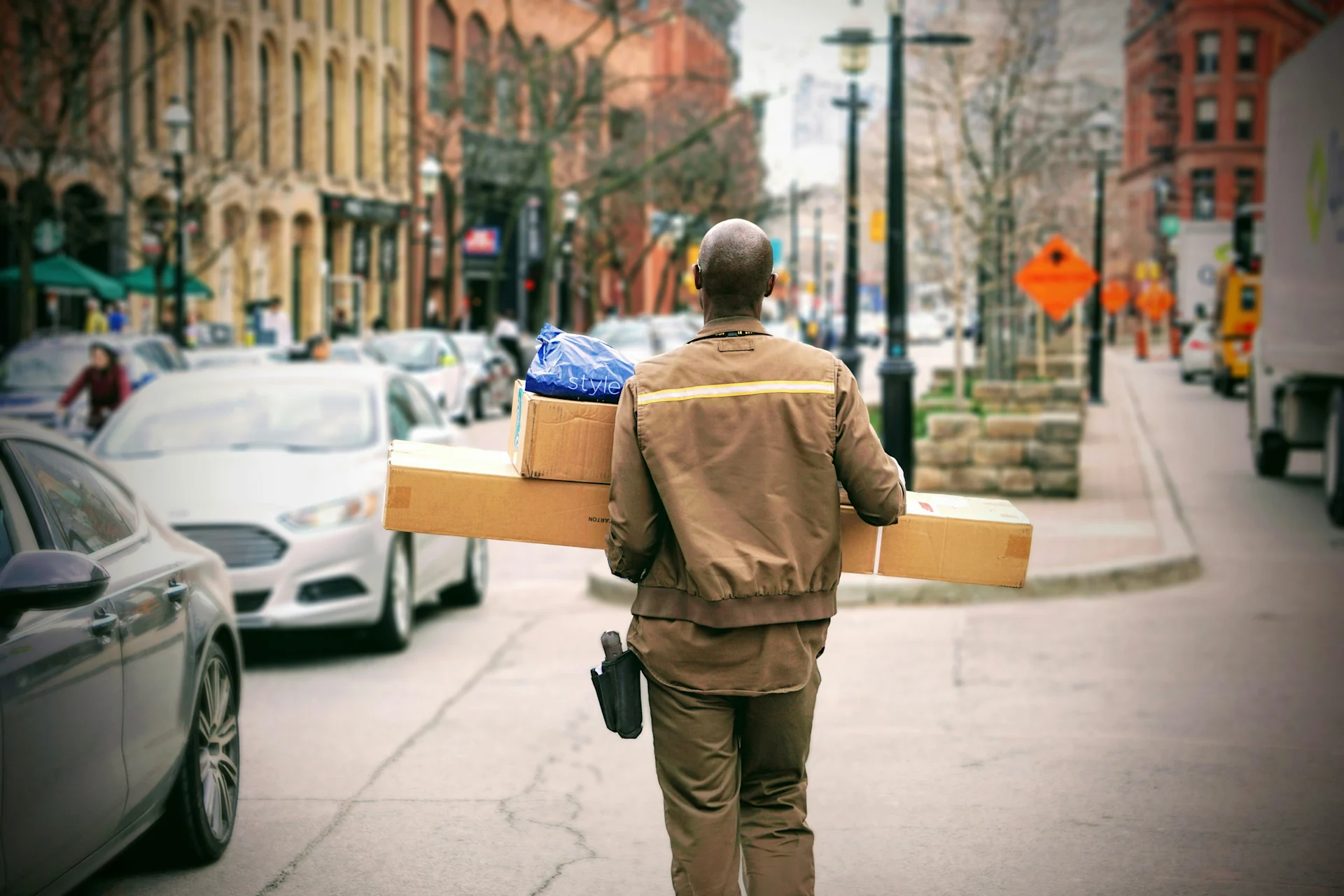 Delivery person carrying parcels