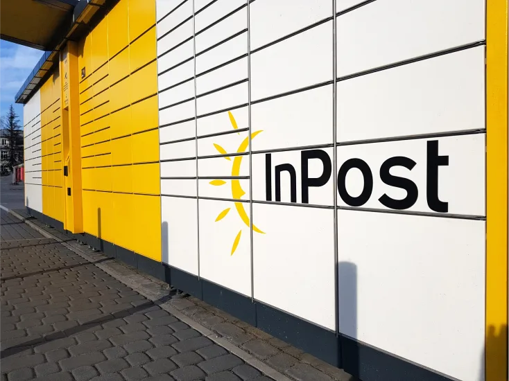 Image of postal pick up lockers with InPost brand logo 