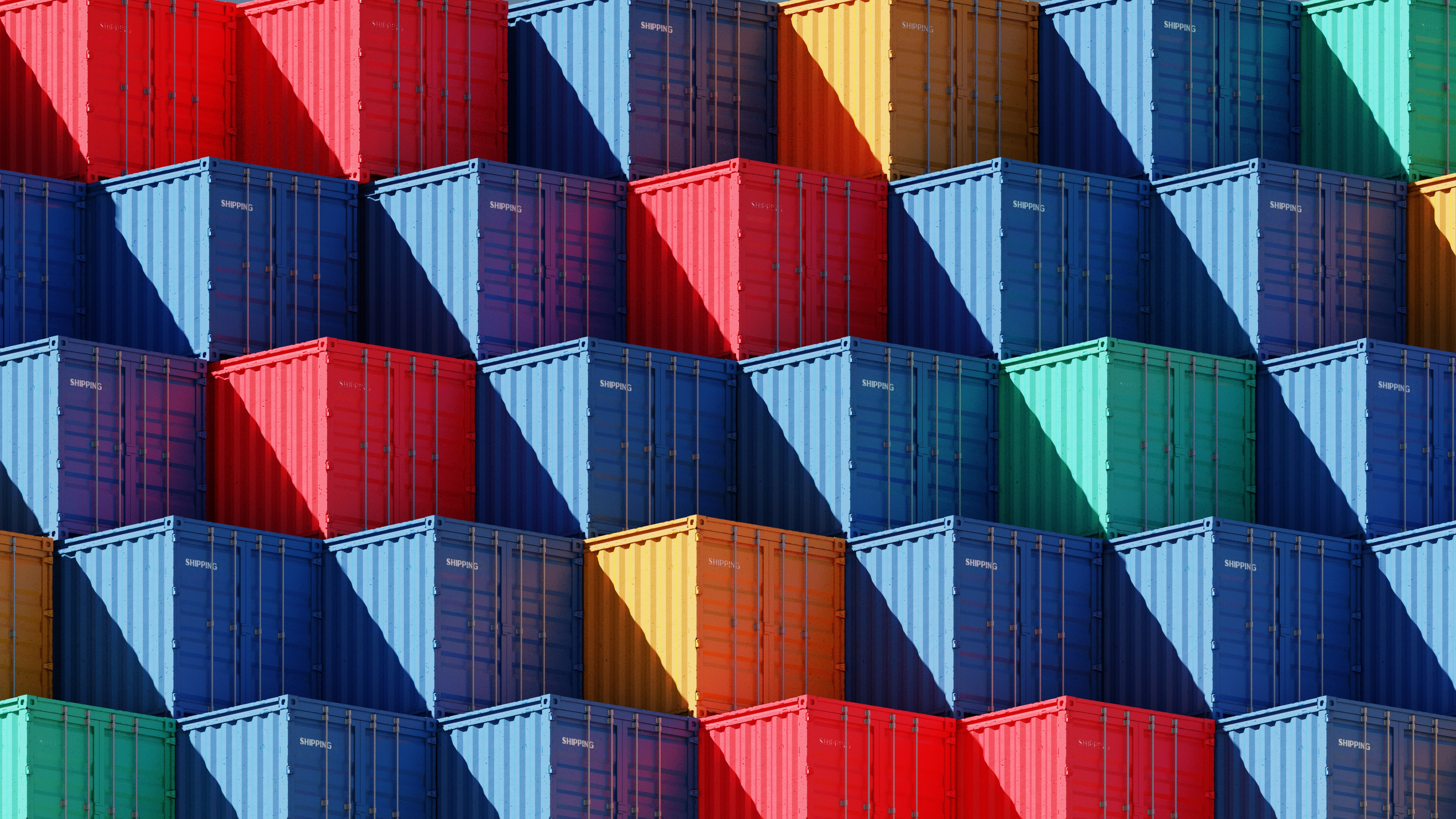 Multicoloured shipping containers stacked together.