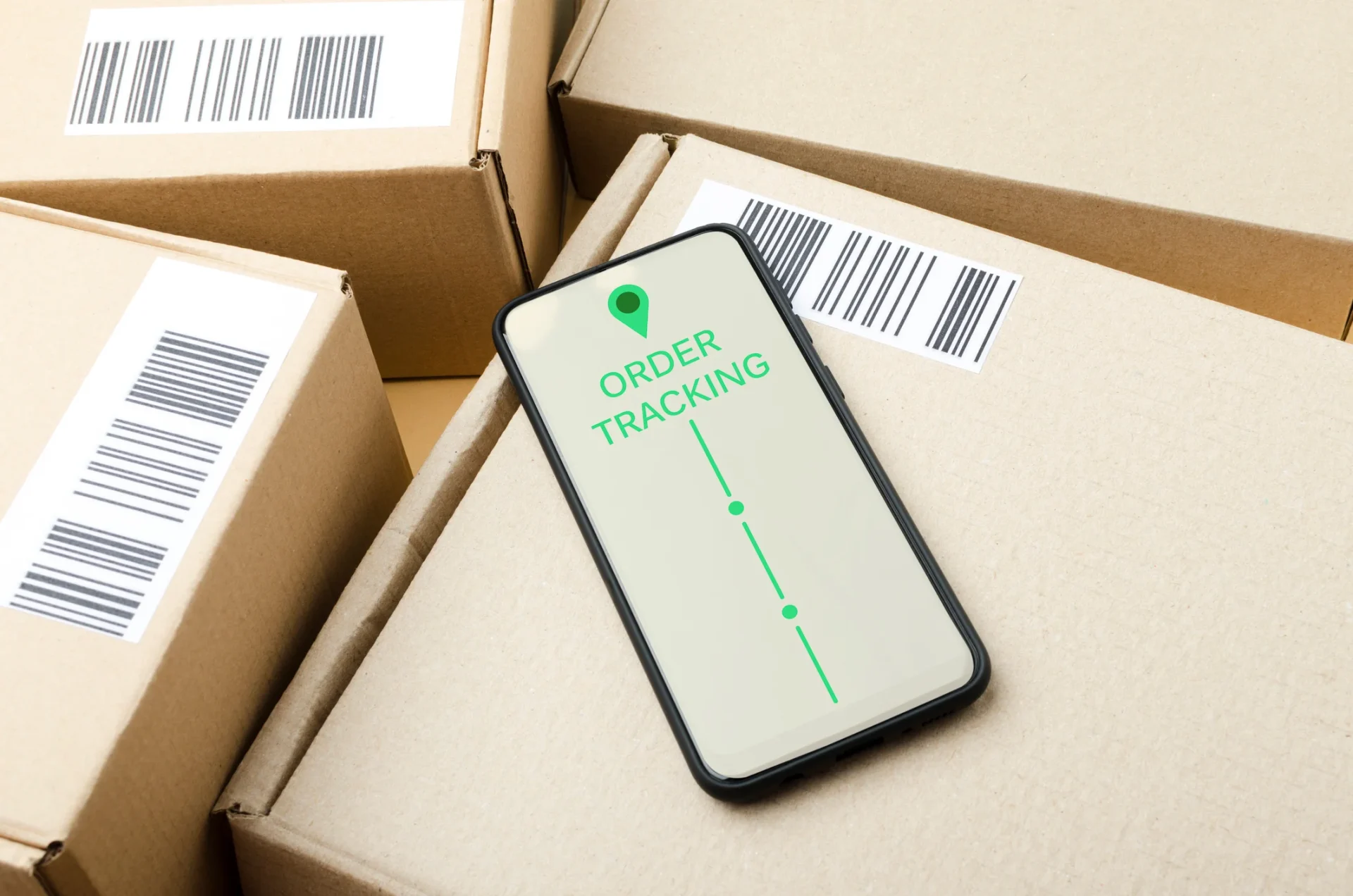 Phone with tracking icon on parcel