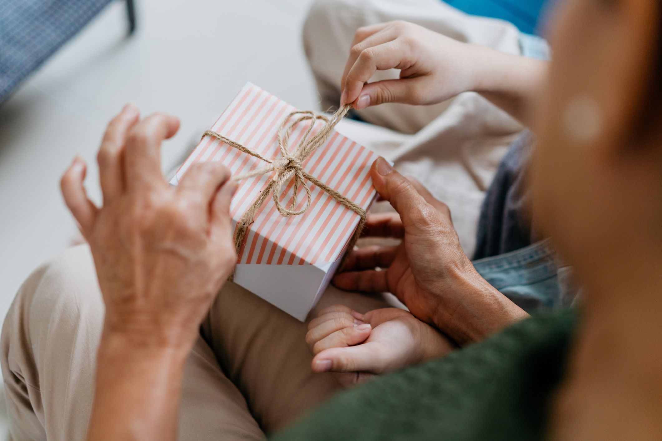 person unwrapping father's day gift