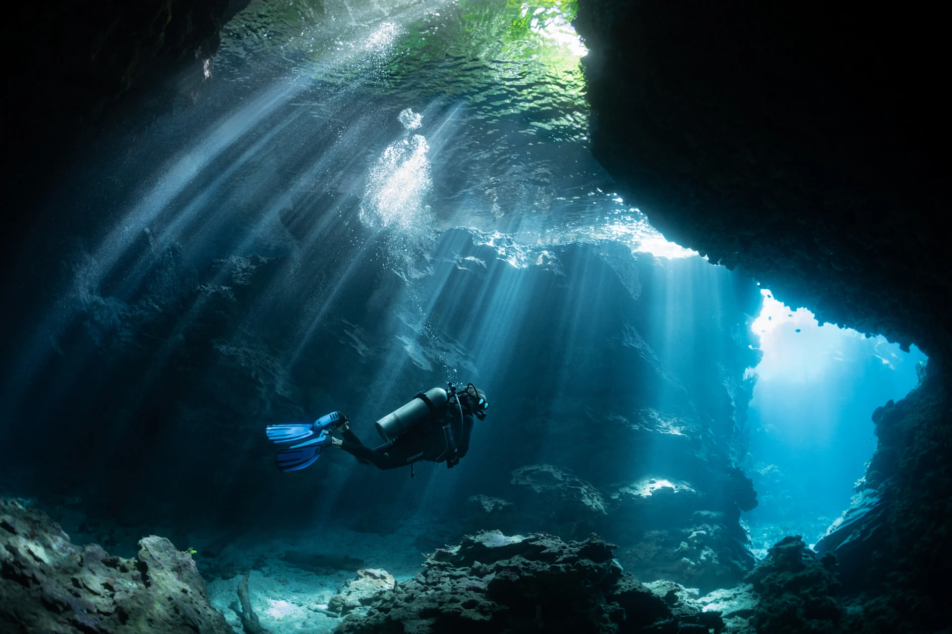 Scuba diver in an underwater cave in the Solomon Islands