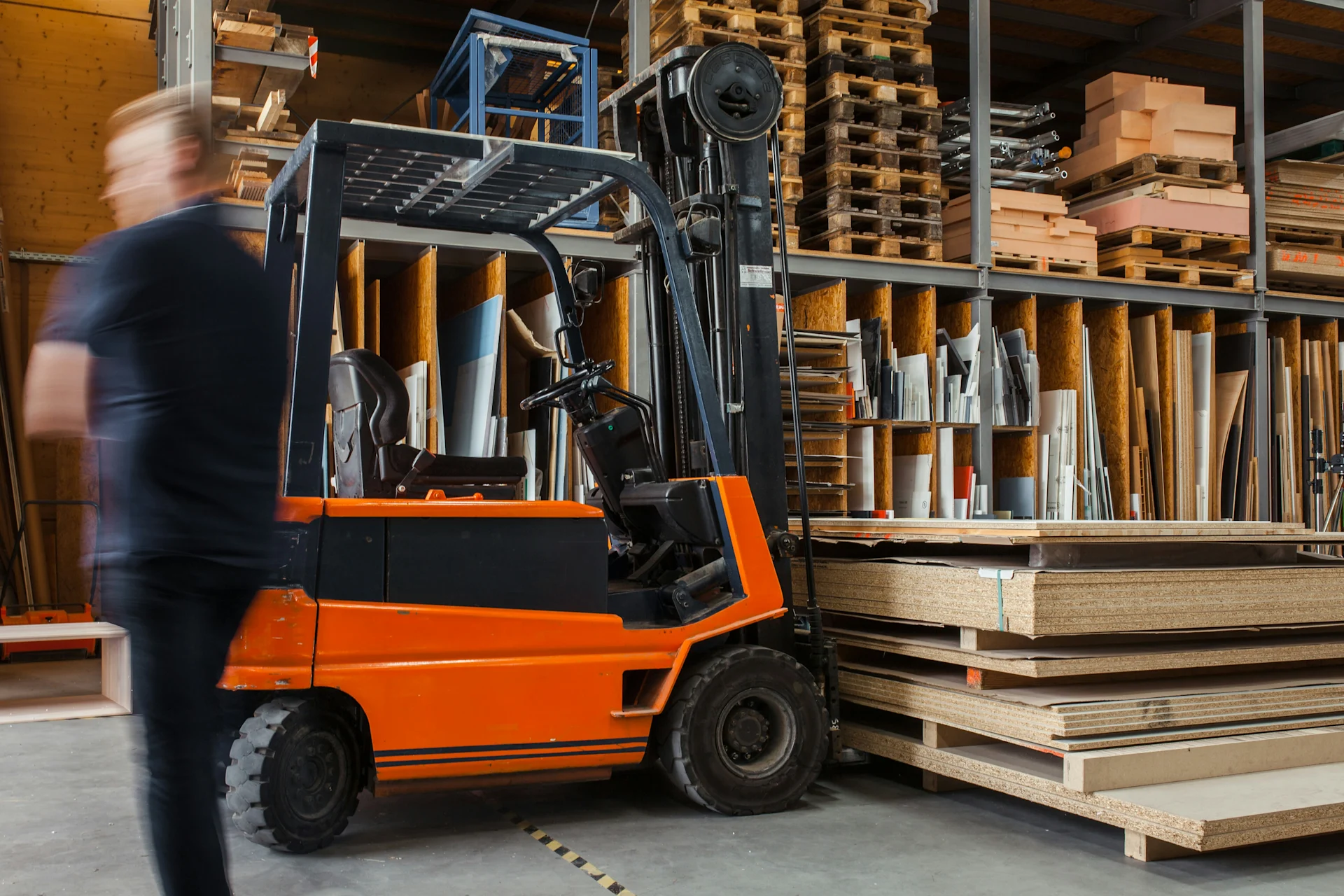 Forklift in warehouse carrying items
