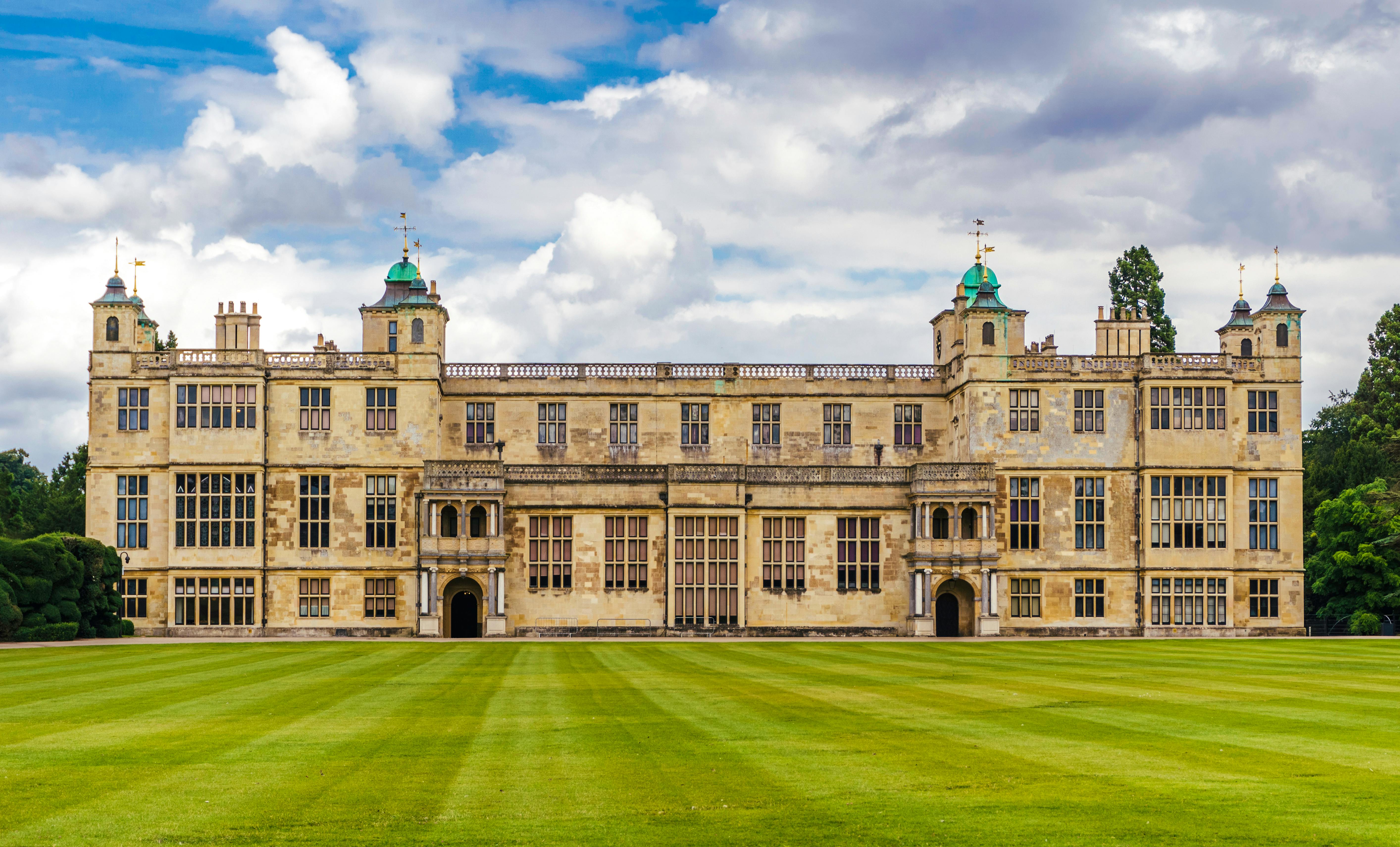 Historic Audley End House. A large estate house surrounded by forest.