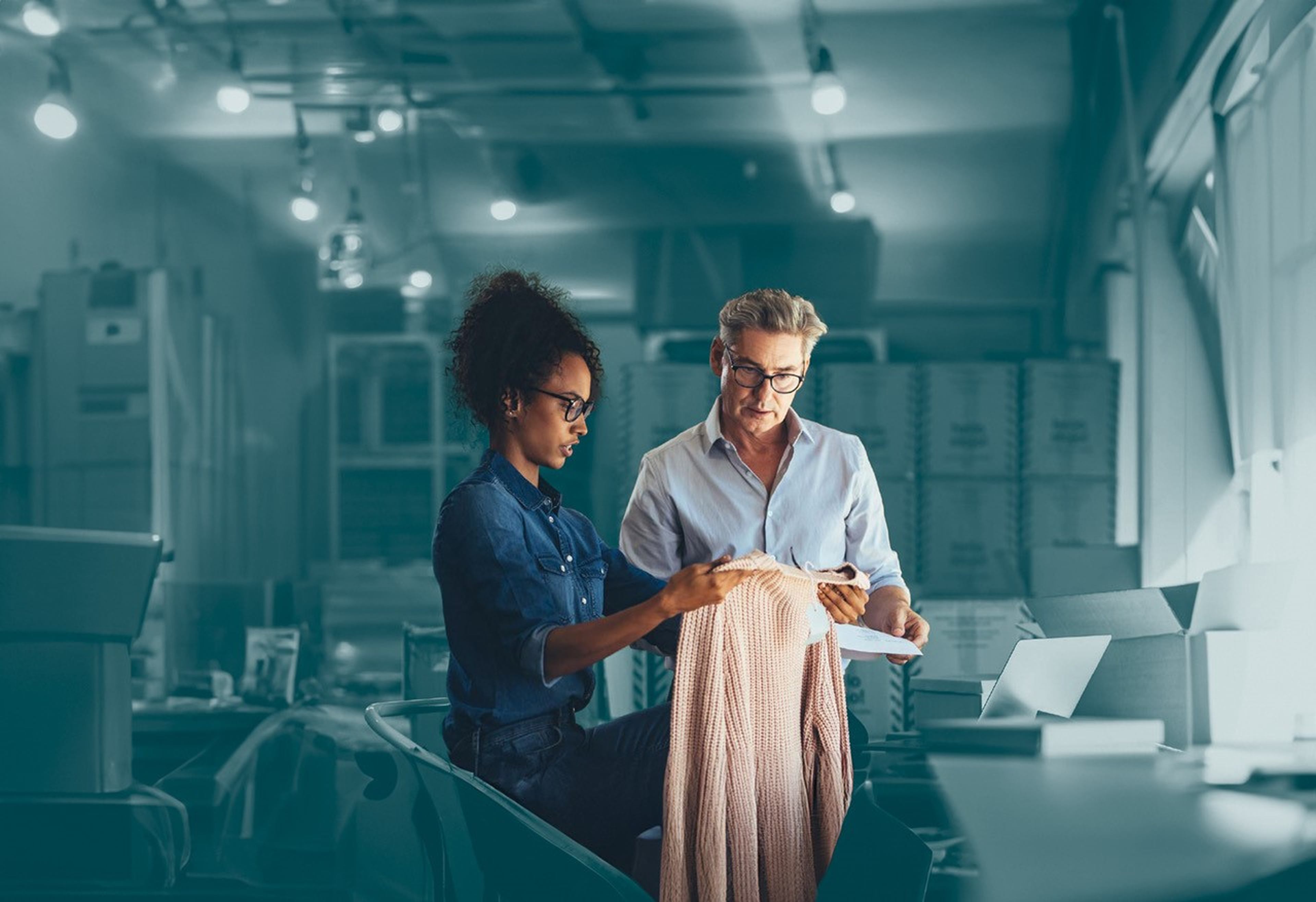 Retailer checking orders man woman