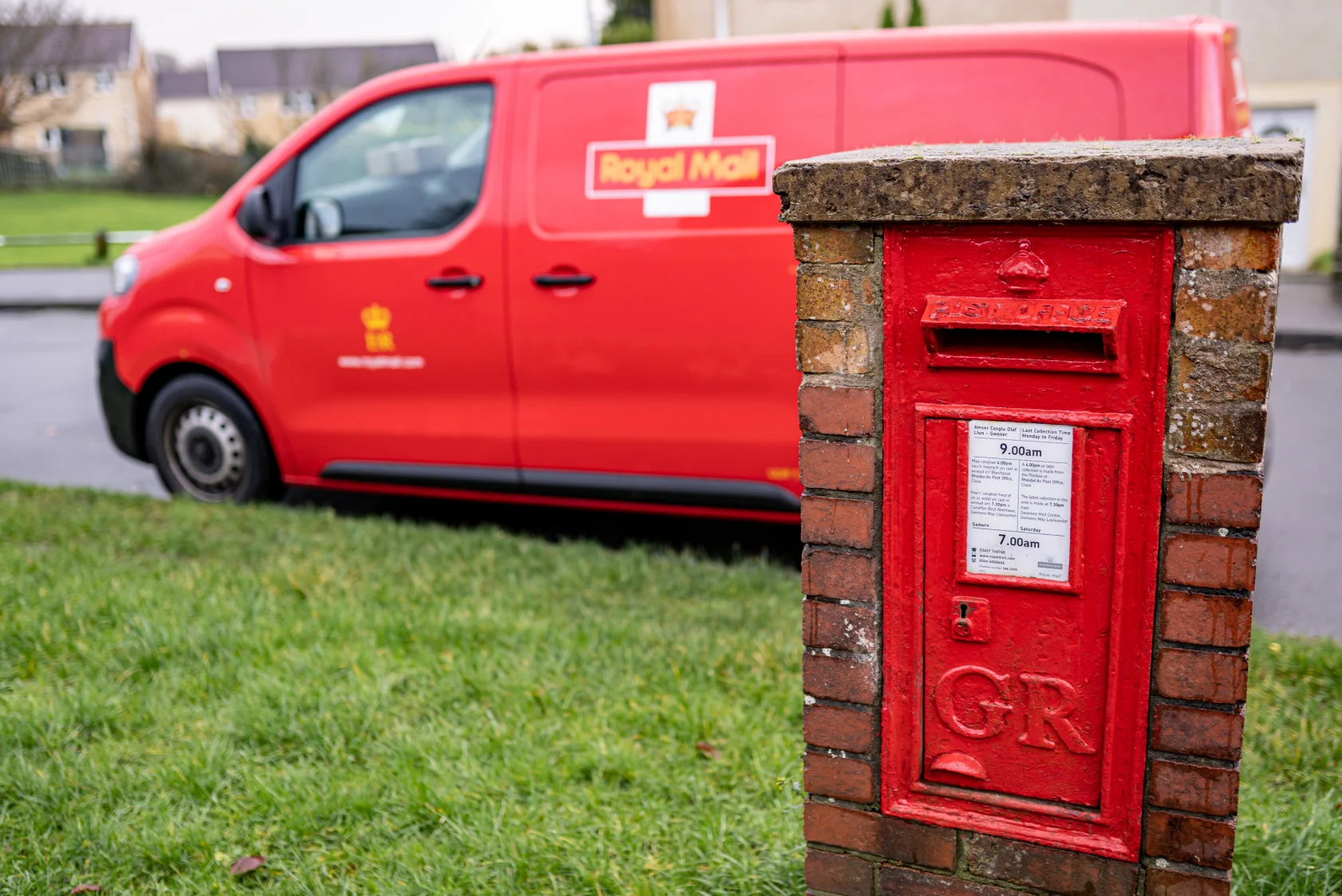 Royal mail courier post box and parked van