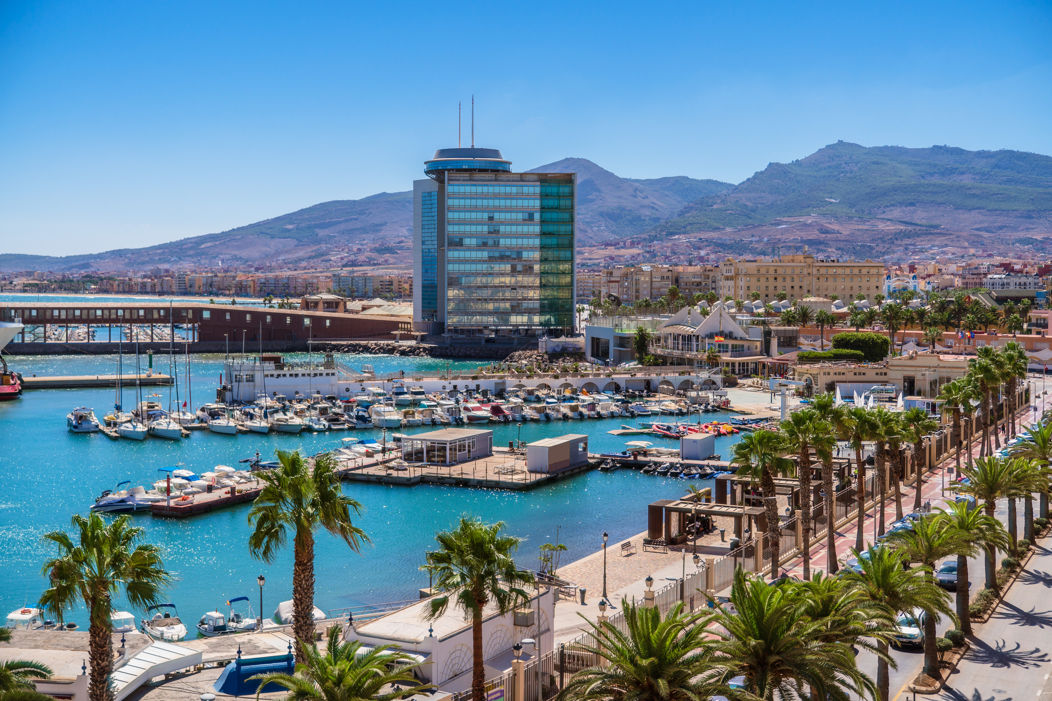 Harbour, palm trees and mountains in Melilla