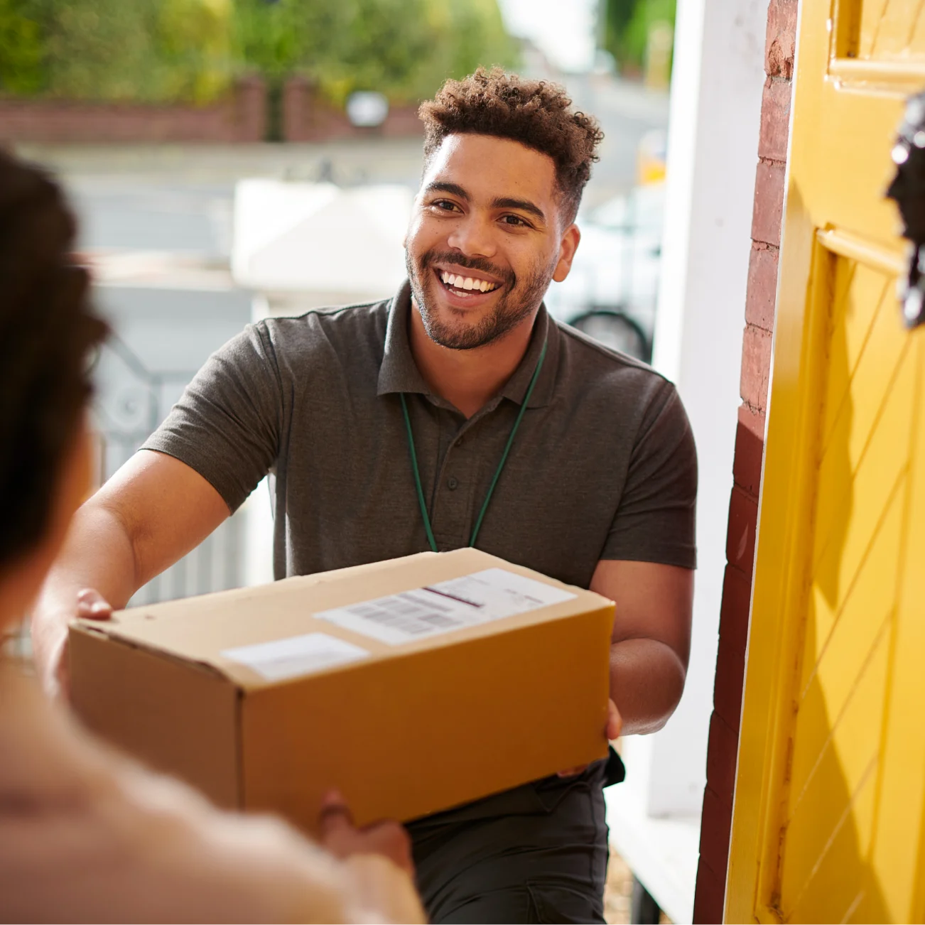 Delivery Man Handing Over Parcel