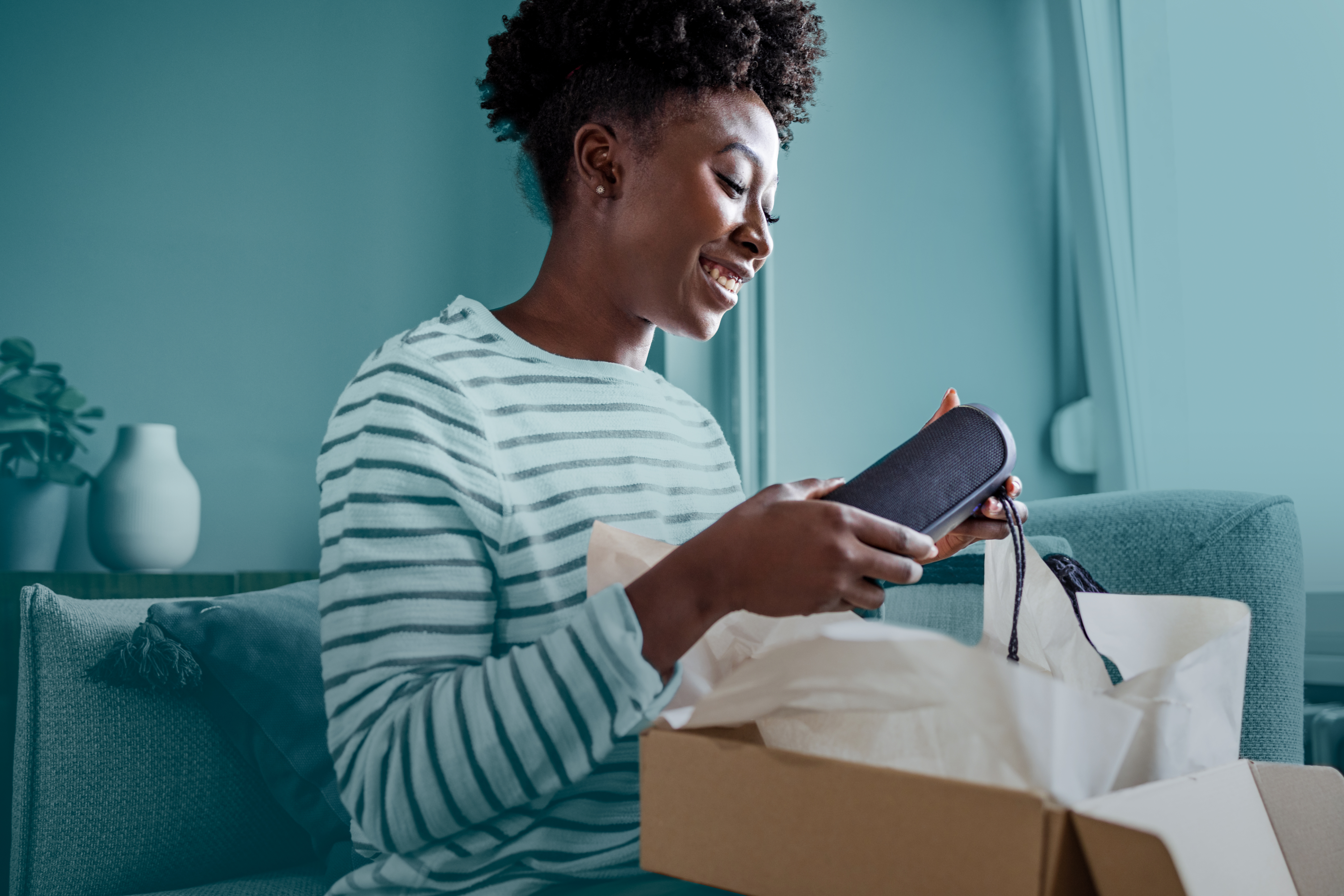 Woman carrying shopping bag and sitting at home
