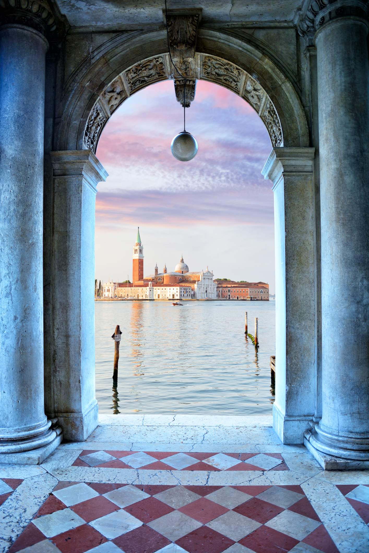 Stone doorway looking out across the river and venice.