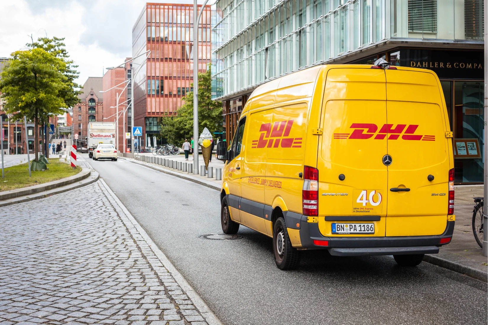 DHL delivery van parked in street