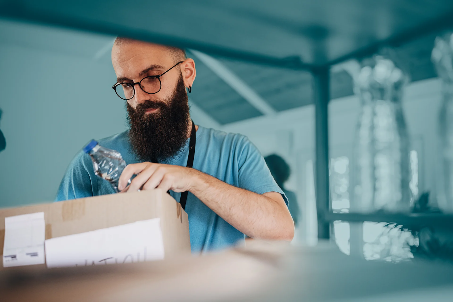 Man opening parcel in shop store