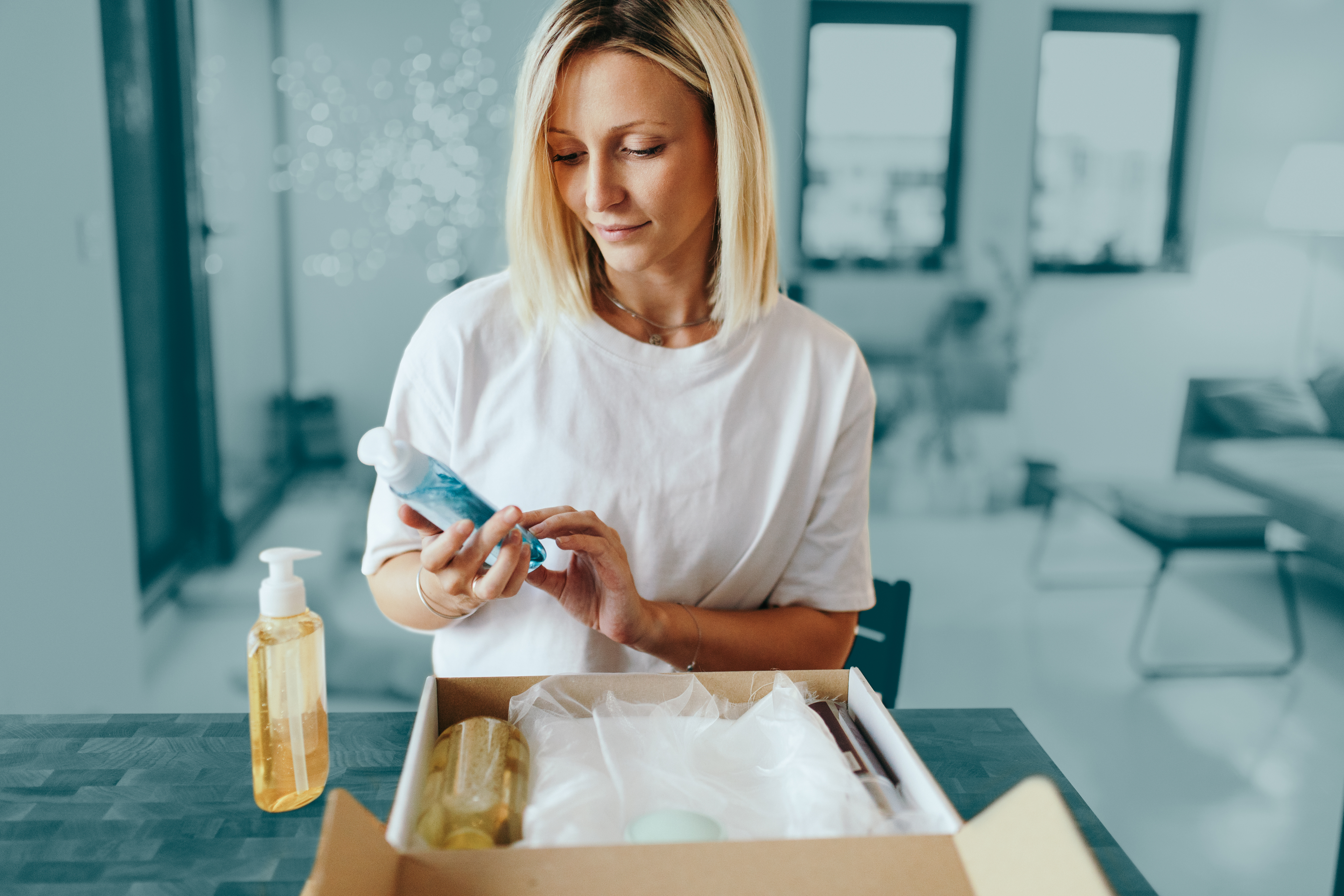 Woman packing parcel at home