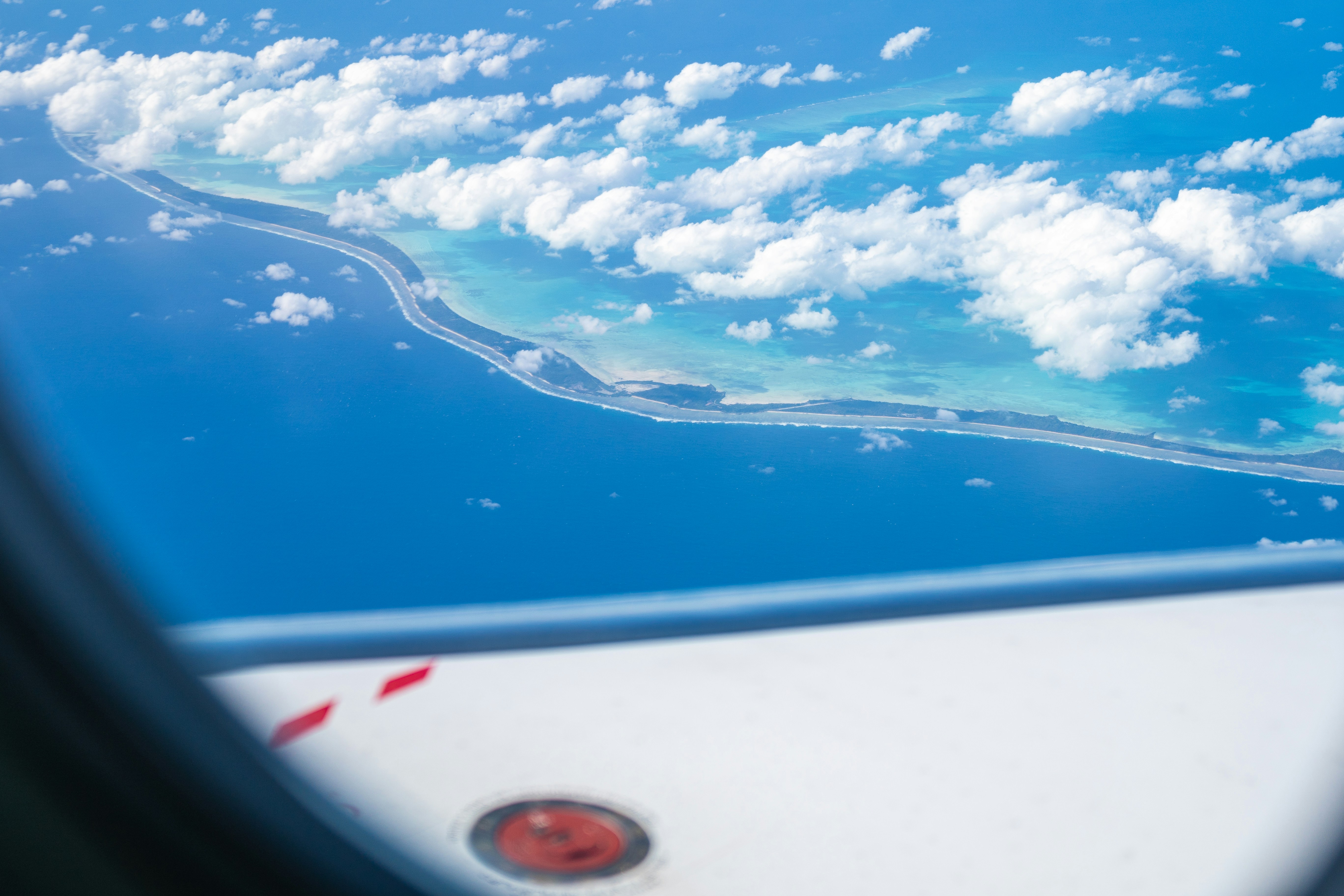 A view of the ocean from a plane window photo