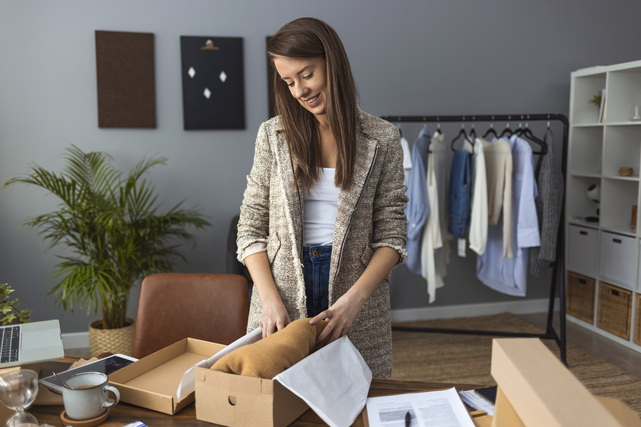 woman packing parcel for selling