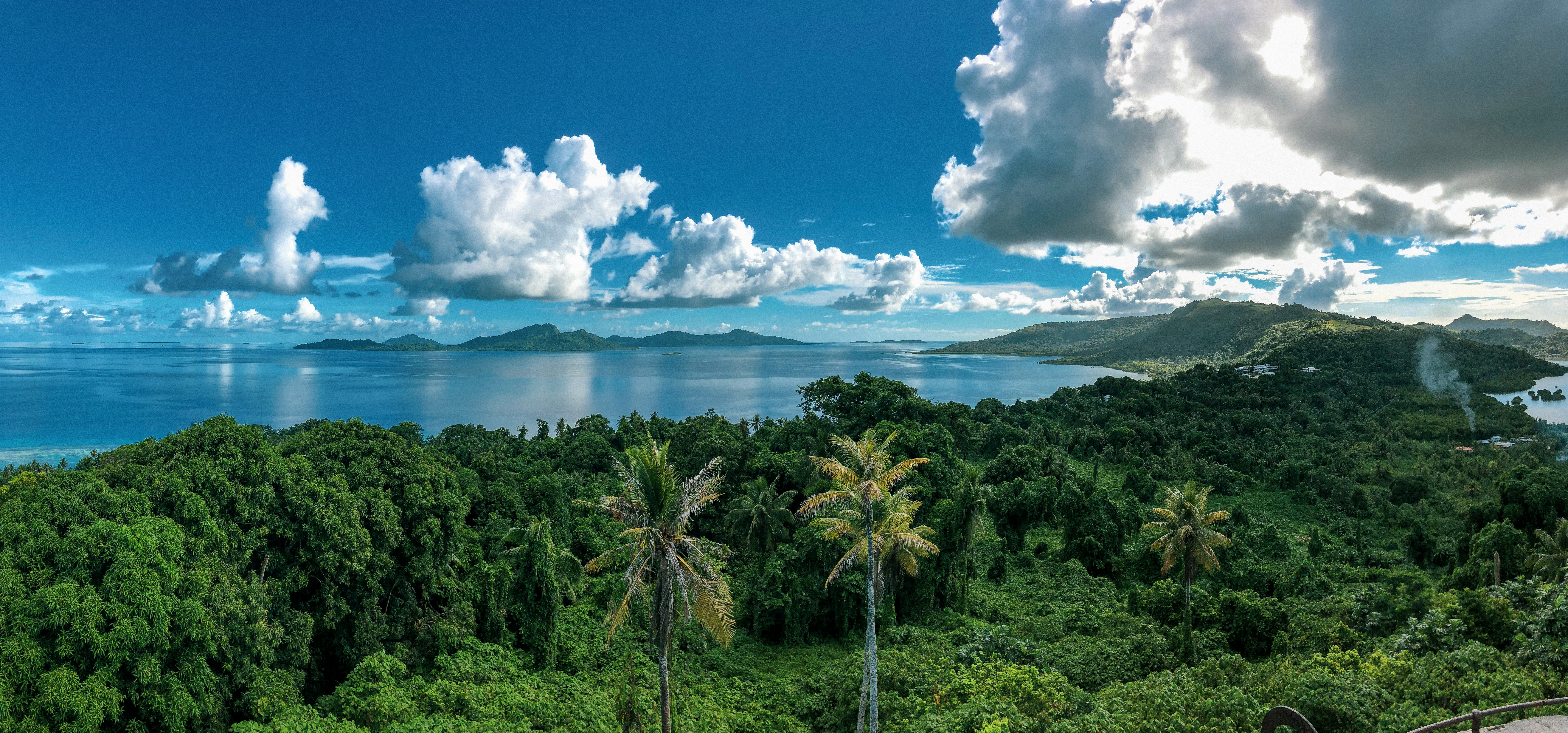 Aerial view of the forest, ocean and mountains. Moen, Chuuk, Federated States of Micronesia, Weno