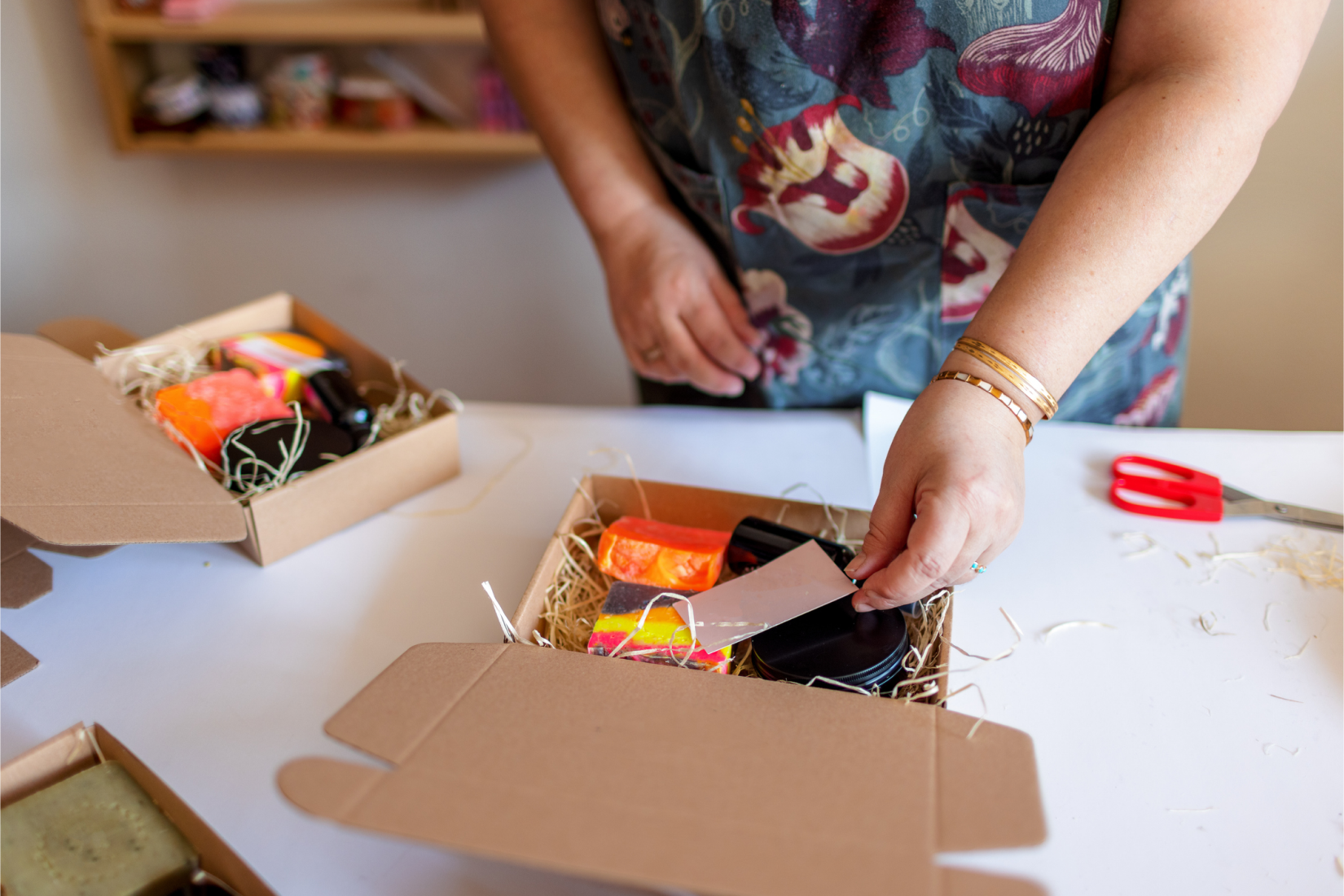 Person packing a folksy parcel