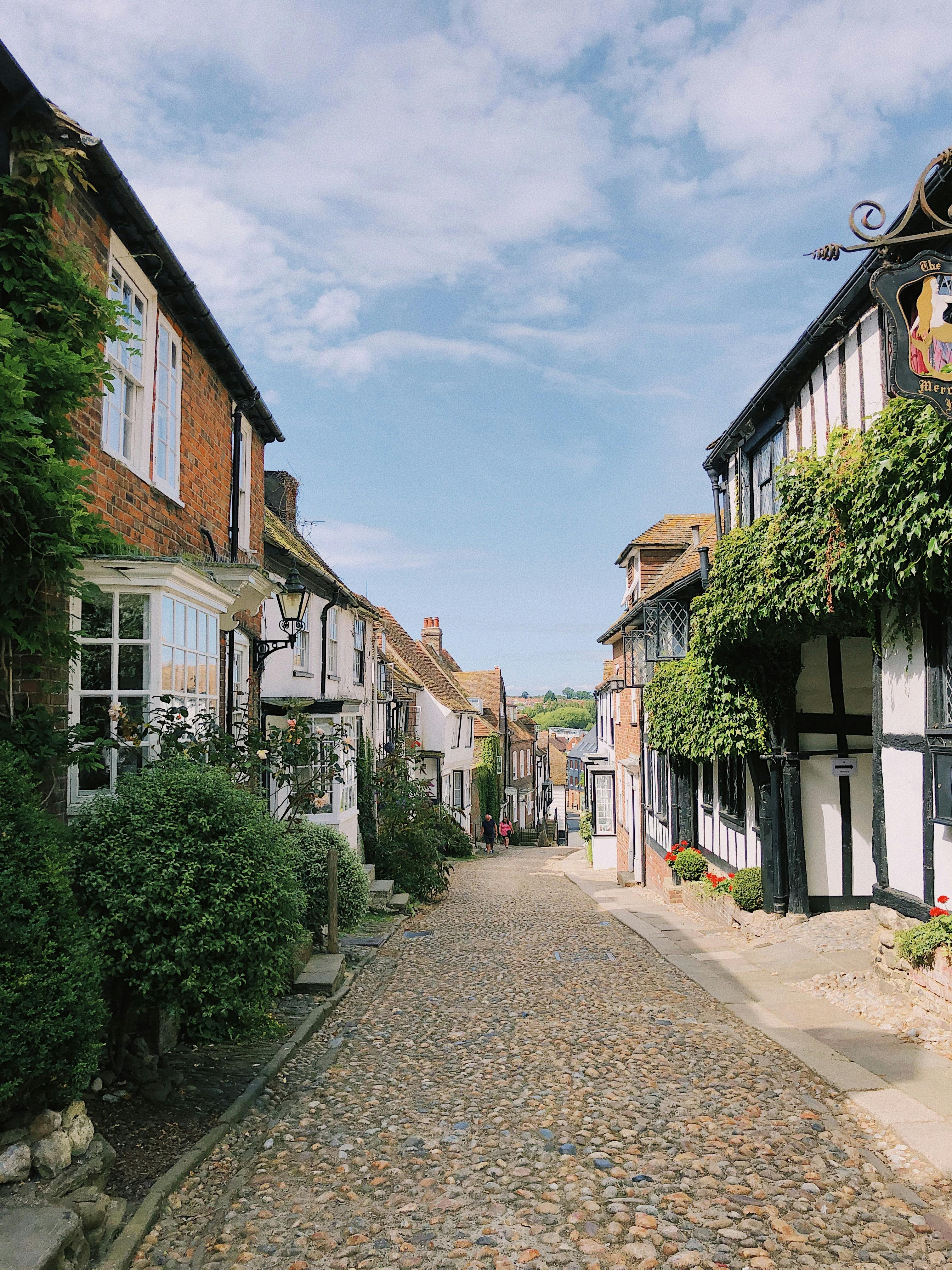 Narrow Cobblestone Street with Old English Houses