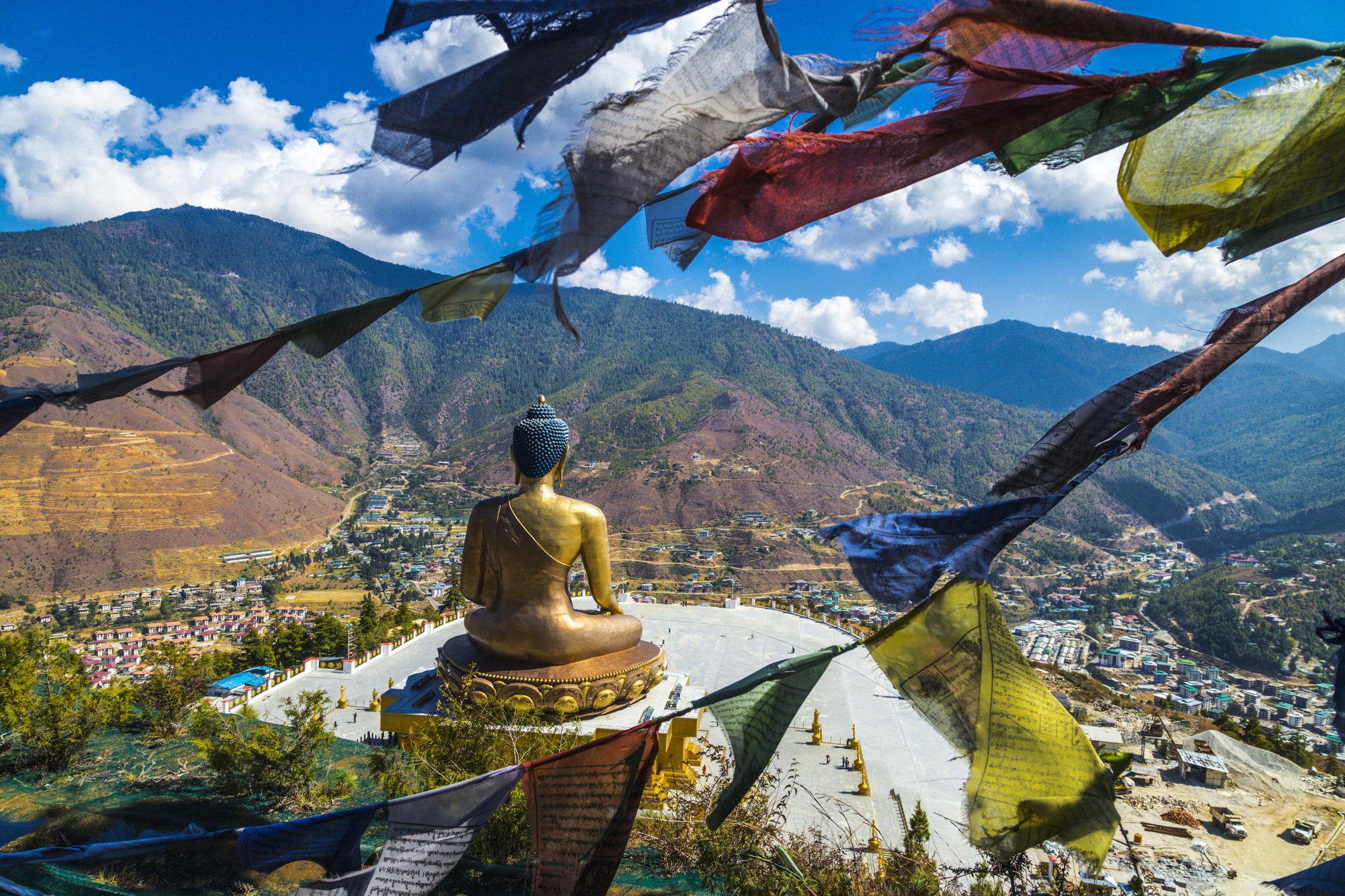 Looking across Golden Buddha statue and mountains across Bhutan.