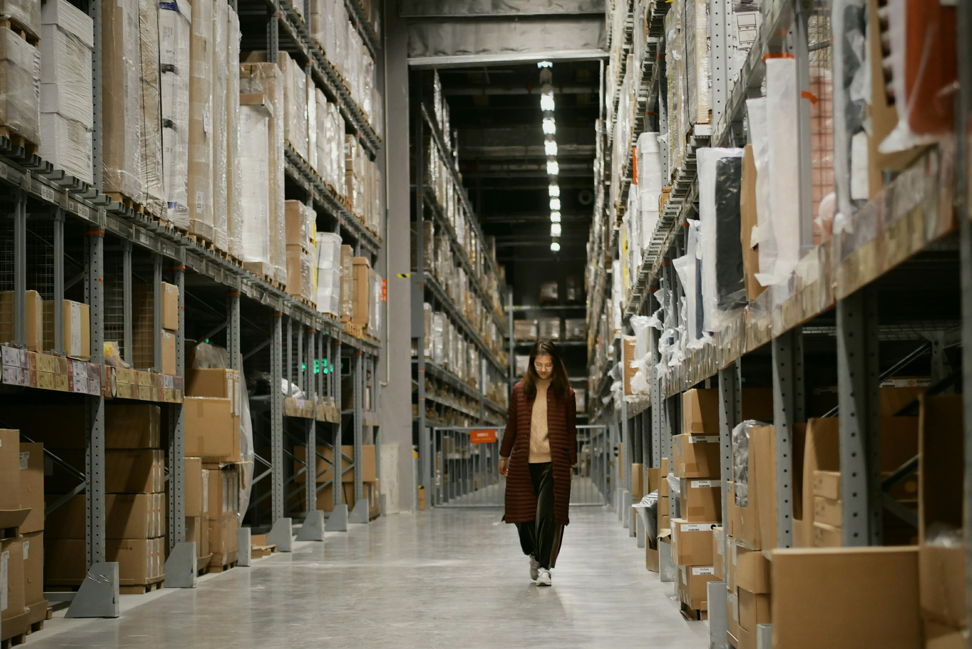 Woman walking through warehouse