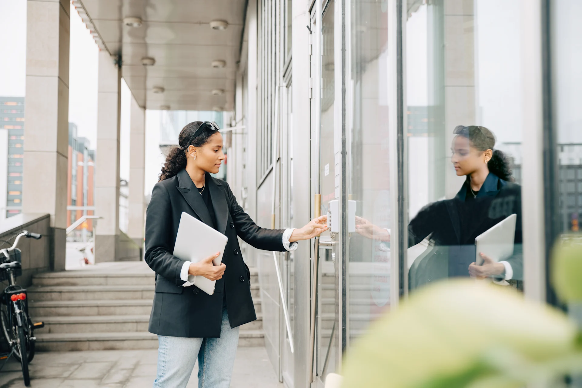 Woman walking into an office building