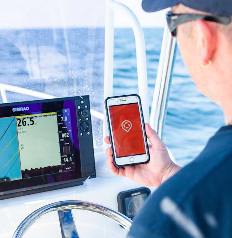 Fisherman using Deckee boating safety app on the water