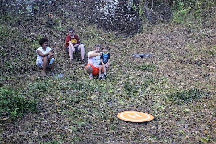 People sit in a field.
