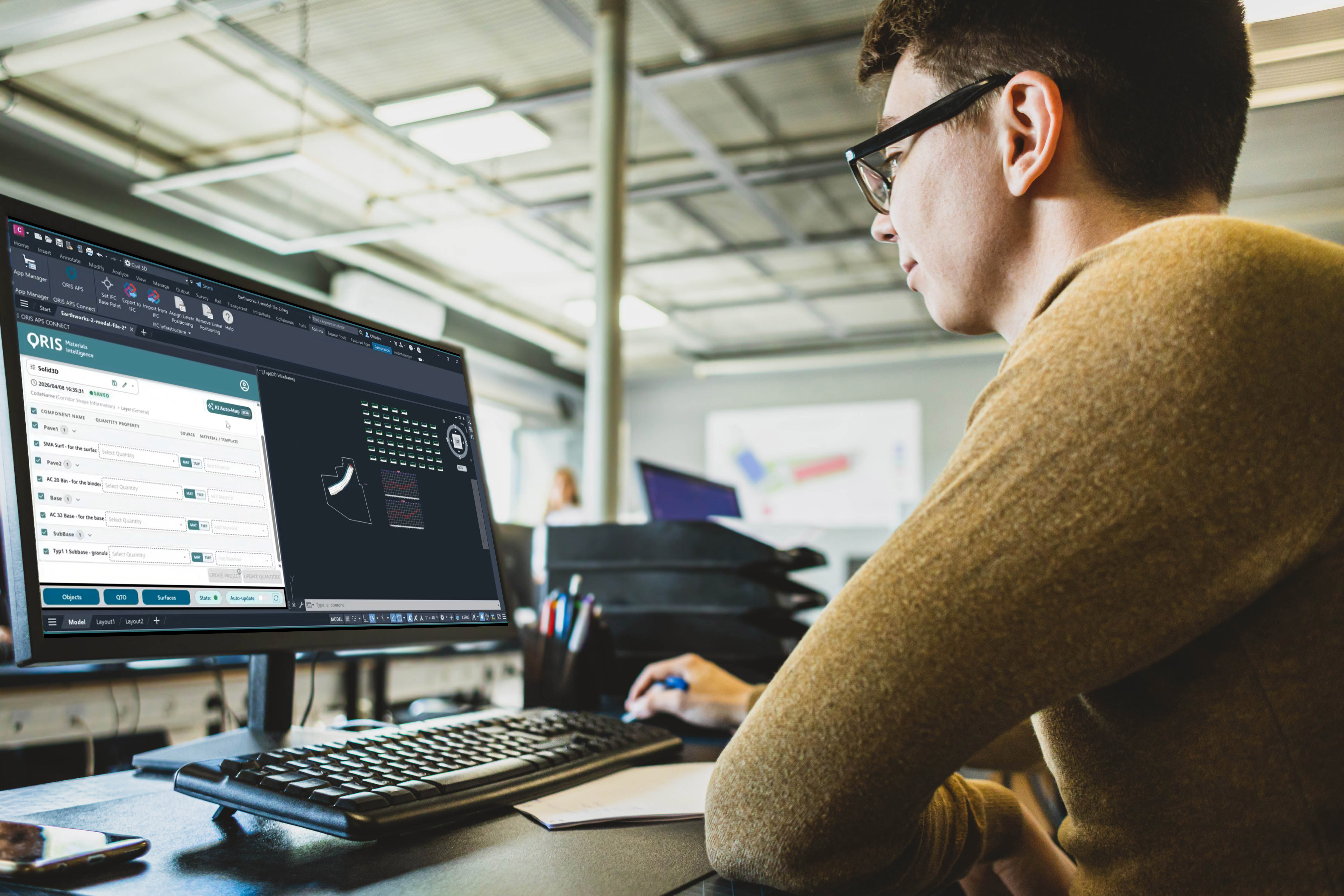 Man working at computer with road rendering 