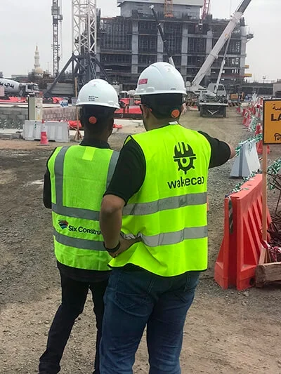 Construction workers on site wearing smart hard hats