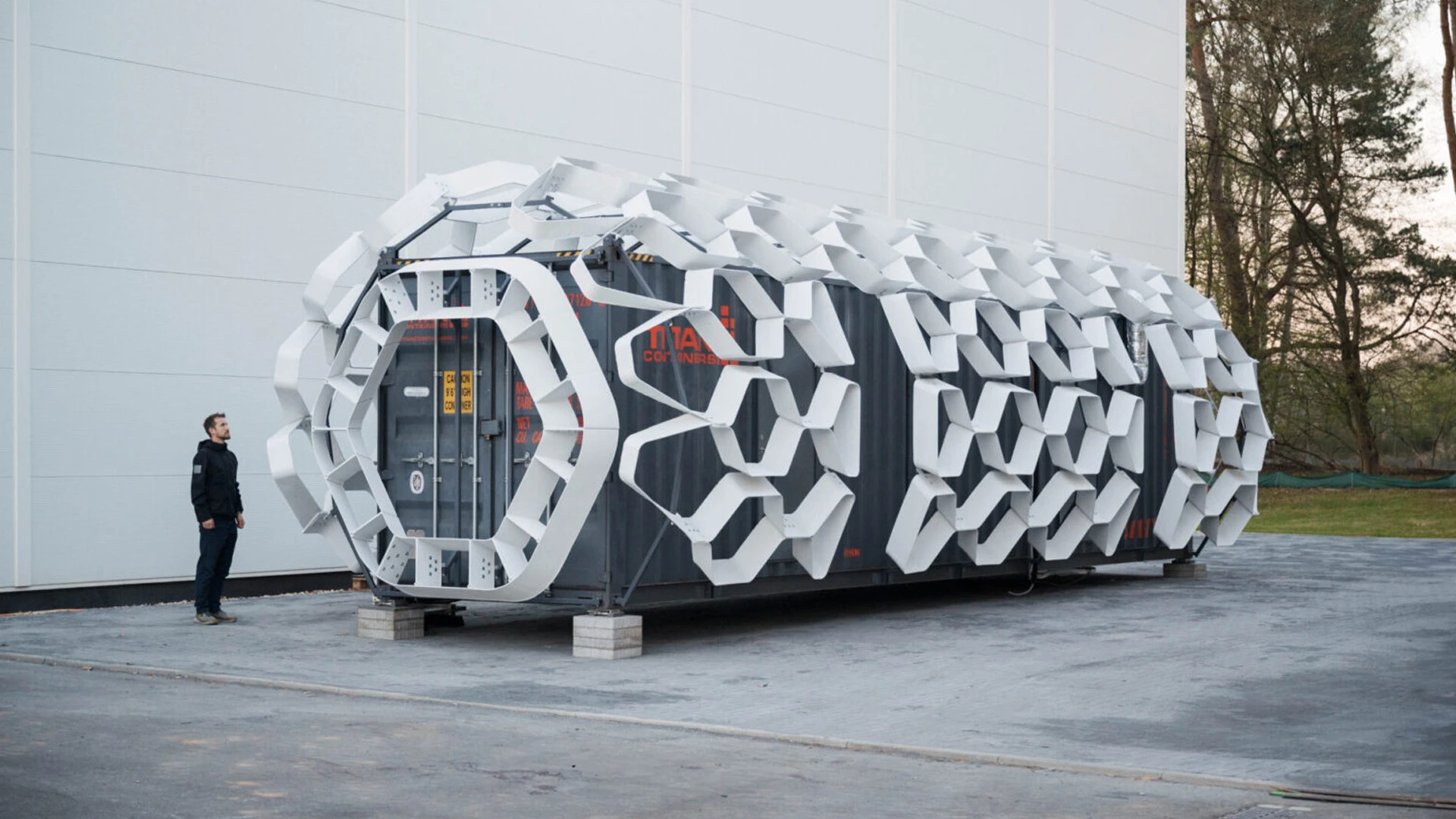 Exterior shot of futuristic living pod designed using shipping container 