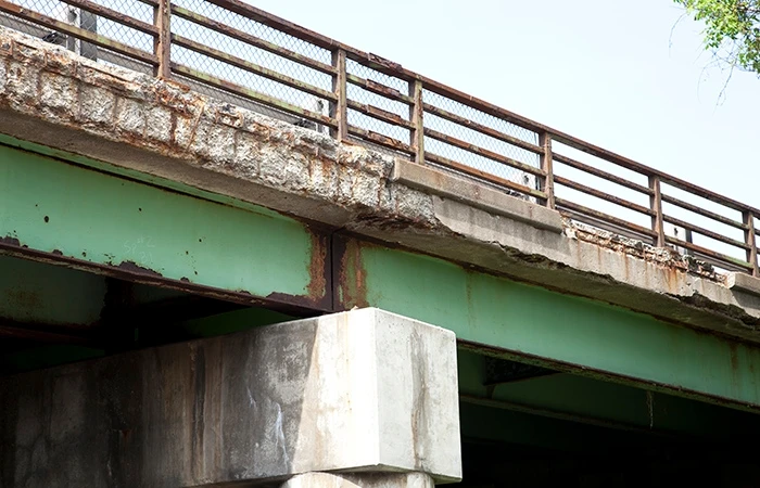 A photograph of a crumbling bridge