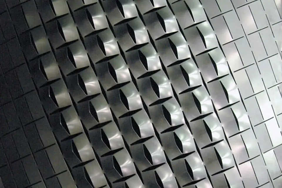 This self-shaping example from 2009—with its variable openings—has implications for building facades, ceilings, and wall systems. 