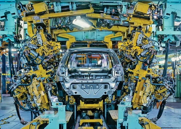 Industrial robots assembling a vehicle