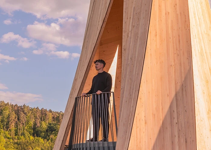 Man looking out of Urbach Tower