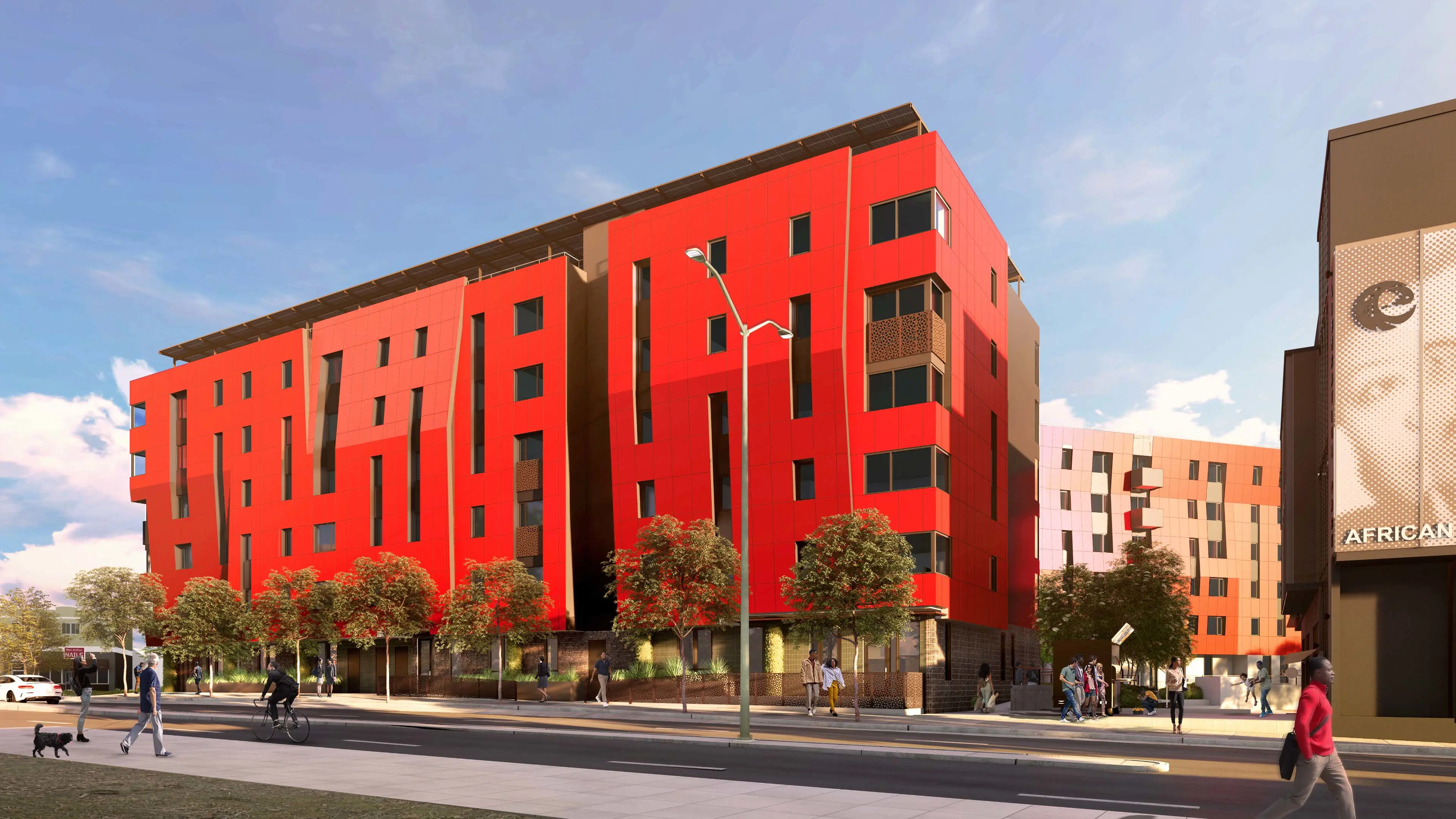 Exterior view of multi-story building with red facade