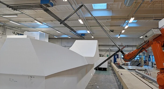 Robotic wire-cutting technique shaping the slab form