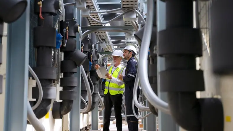 Manufacturing engineers working on line.