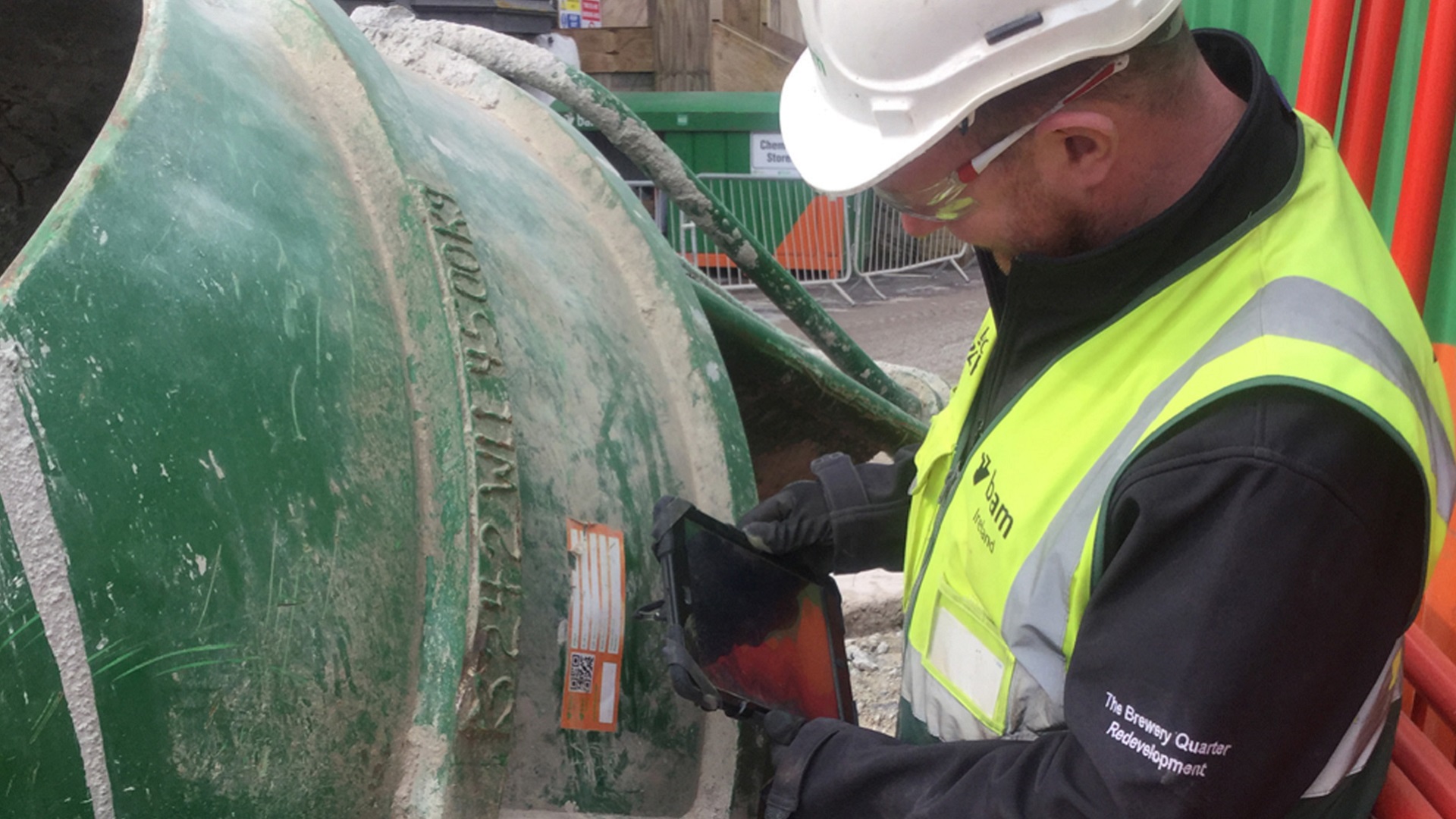 A site manager on a BAM Ireland worksite uses an iPad to capture data.