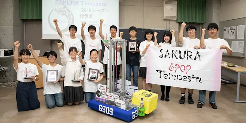 The FIRST Robotics team poses for a picture.
