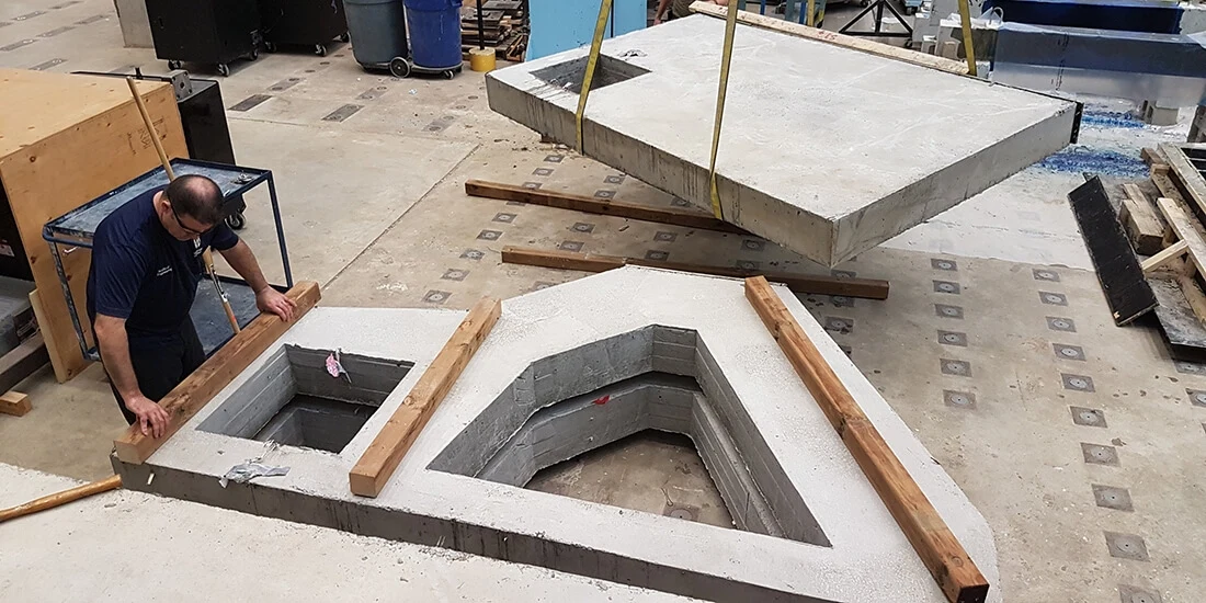 Concrete forms take shape in a factory.