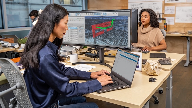 Architects working on computers in an office