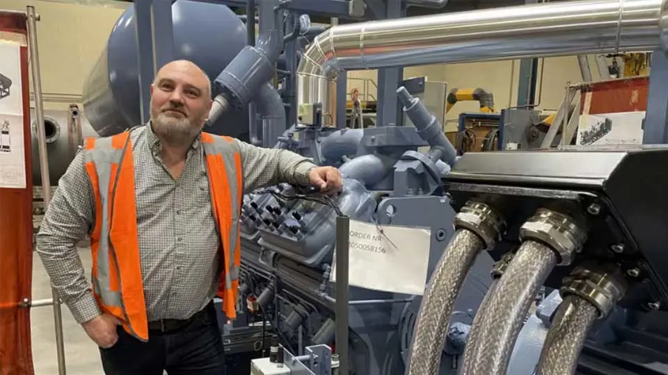 a man leaning on a machine
