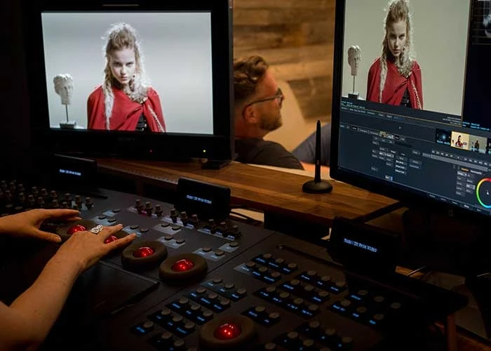 people working on a computing editing a film