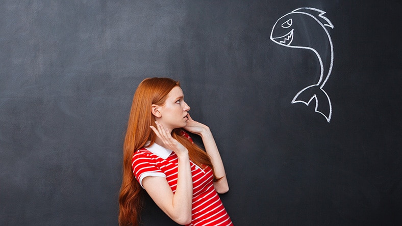 A woman poses to create pixilation animation.